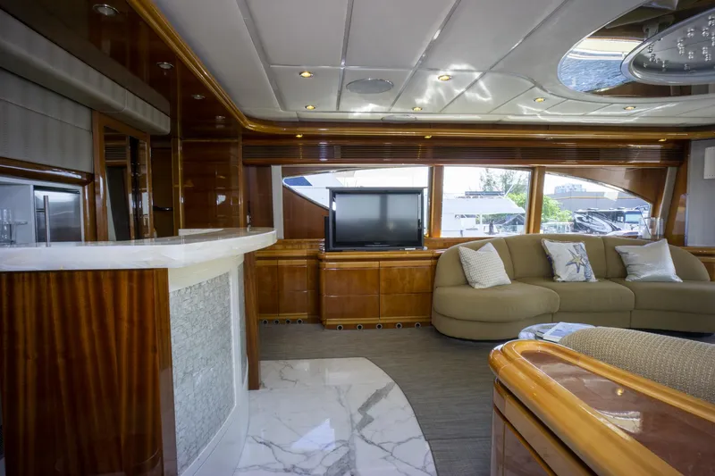 Paladin Yacht Photos Pics Luxurious interior of 2000 Ferretti Yachts Custom Line 94 with elegant wood finishes.