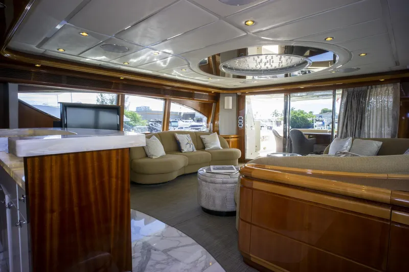 Paladin Yacht Photos Pics Luxurious interior of 2000 Ferretti Yachts Custom Line 94 with elegant seating and wood finishes.