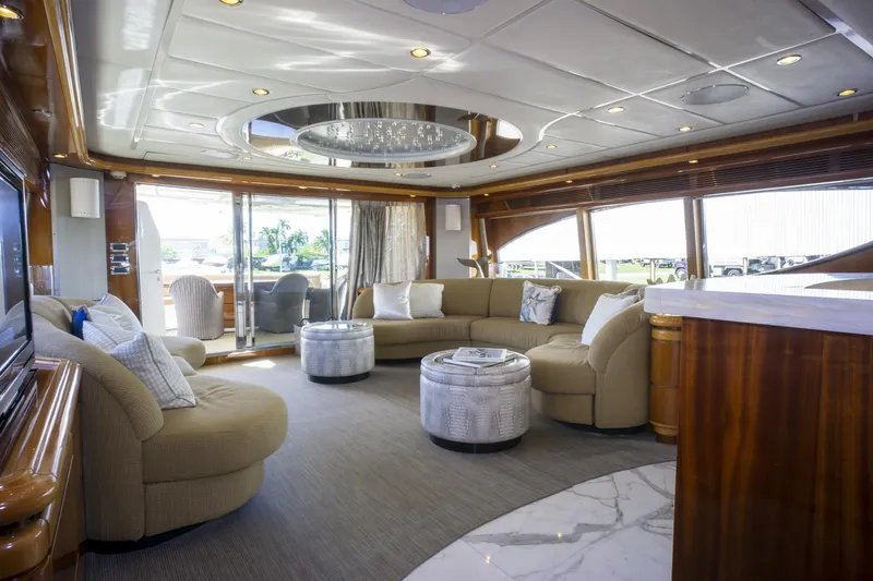 Paladin Yacht Photos Pics Luxurious interior of 2000 Ferretti Yachts Custom Line 94 with elegant seating and modern design.