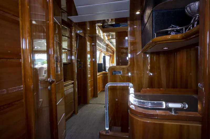 Paladin Yacht Photos Pics Luxurious interior of 2000 Ferretti Yachts Custom Line 94 with polished wood finishes.