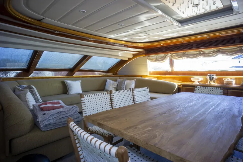 Paladin Yacht Photos Pics Luxurious interior of 2000 Ferretti Yachts Custom Line 94 with elegant seating and dining area.