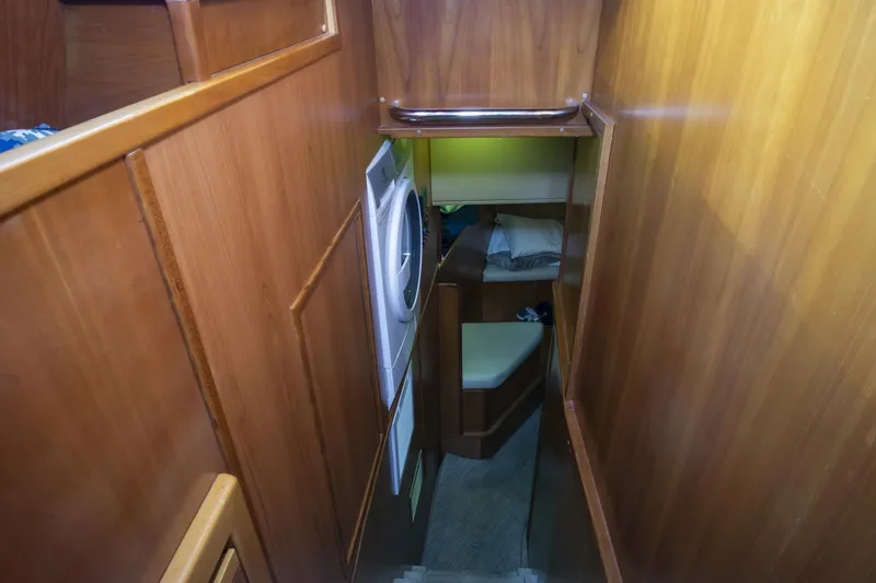 Paladin Yacht Photos Pics Interior hallway of 2000 Ferretti Yachts Custom Line 94 with wood paneling.