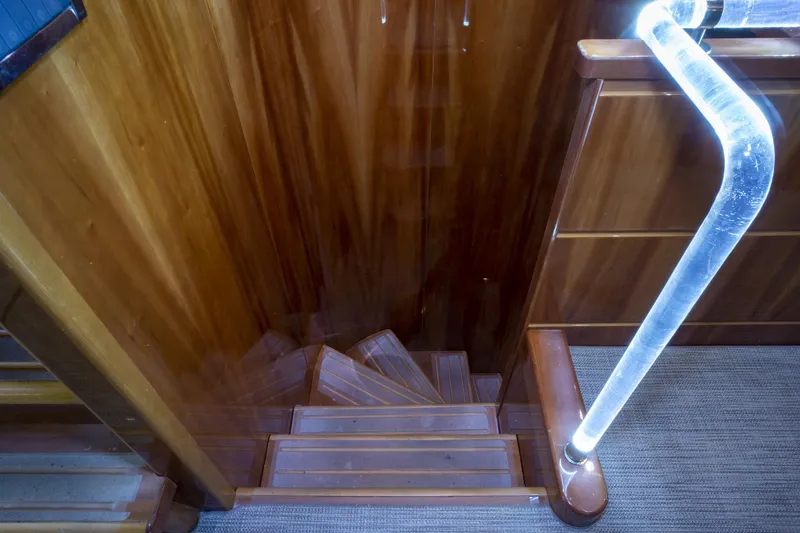 Paladin Yacht Photos Pics Wooden staircase with illuminated handrail on 2000 Ferretti Yachts Custom Line 94.