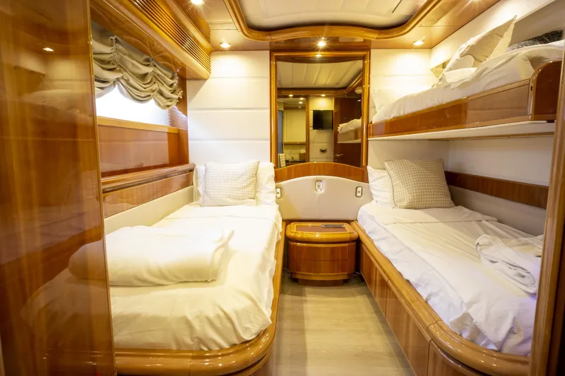 Paladin Yacht Photos Pics Luxurious cabin interior of 2000 Ferretti Yachts Custom Line 94 with elegant wood finishes.