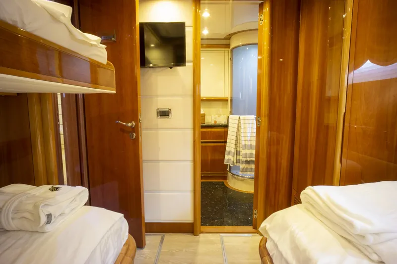 Paladin Yacht Photos Pics Luxurious cabin interior of 2000 Ferretti Yachts Custom Line 94 with wooden finishes.