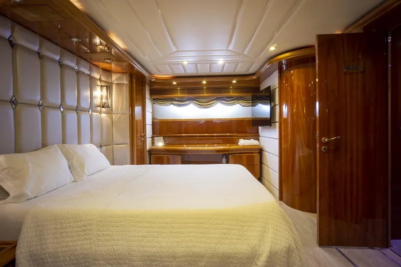 Paladin Yacht Photos Pics Luxurious bedroom interior on 2000 Ferretti Yachts Custom Line 94.