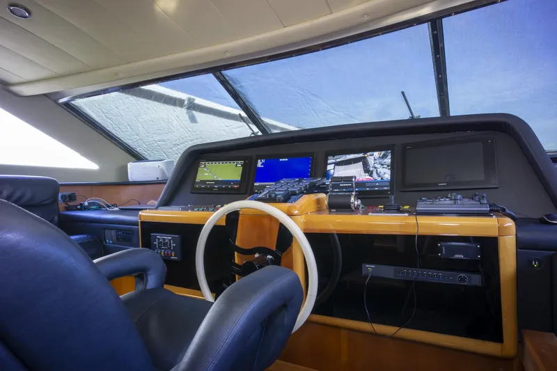 Paladin Yacht Photos Pics Cockpit of 2000 Ferretti Yachts Custom Line 94 with navigation equipment and steering wheel.