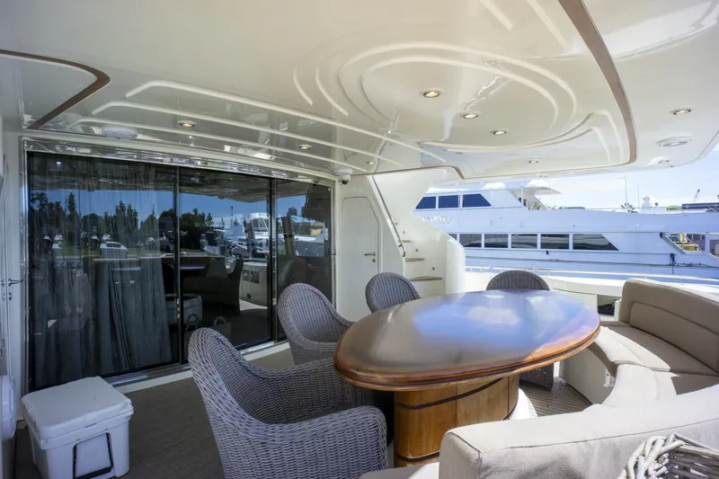 Paladin Yacht Photos Pics Luxurious 2000 Ferretti Yachts Custom Line 94 deck with elegant seating and table.