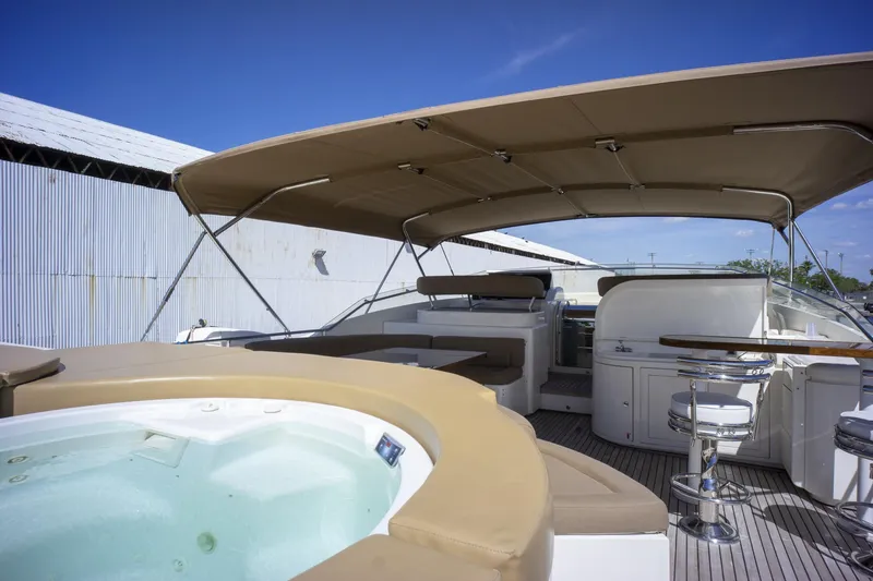 Paladin Yacht Photos Pics Luxurious 2000 Ferretti Yachts Custom Line 94 with jacuzzi and shaded deck area.