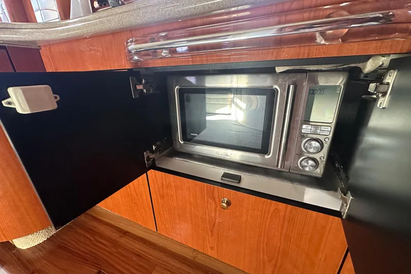 Navion Yacht Photos Pics Microwave in 2001 Sea Ray 510 Sundancer yacht kitchen cabinet.