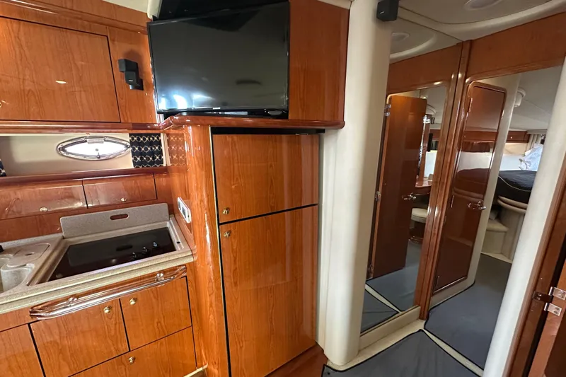 Navion Yacht Photos Pics Luxurious interior of 2001 Sea Ray 510 Sundancer yacht with wood cabinetry and modern amenities.