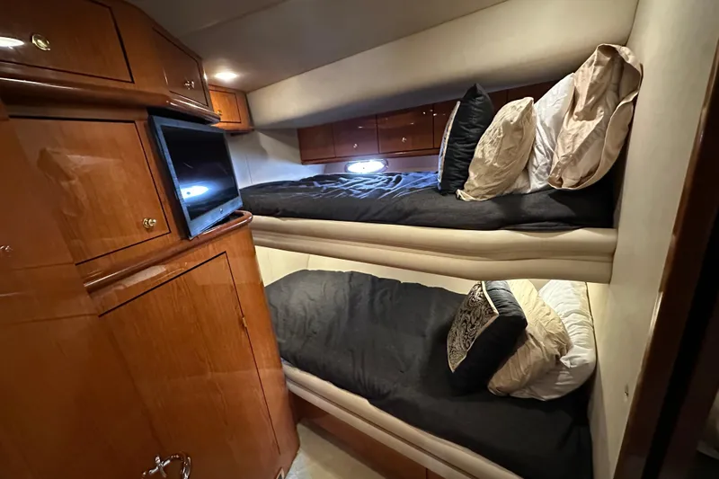 Navion Yacht Photos Pics Luxurious cabin interior of 2001 Sea Ray 510 Sundancer with bunk beds and TV.