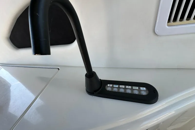 Navion Yacht Photos Pics Control panel on 2001 Sea Ray 510 Sundancer yacht, featuring multiple buttons and a sleek design.