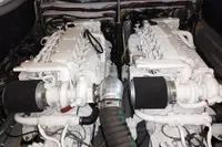 Twin engines of a 2008 SACS Strider boat, showcasing intricate mechanical components.