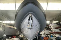 2008 SACS Strider boat in storage, viewed from the front, showcasing sleek design.