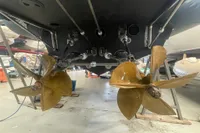 Propellers of 2008 SACS Strider boat in a workshop setting.