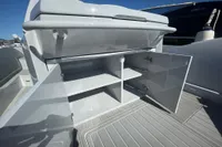 Open storage compartment on 2008 SACS Strider boat, featuring sleek design and ample shelving.