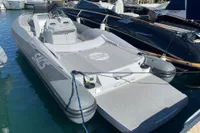 2008 SACS Strider boat docked in marina, featuring sleek design and spacious deck.