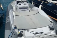 2008 SACS Strider boat with spacious deck and seating, docked in marina.