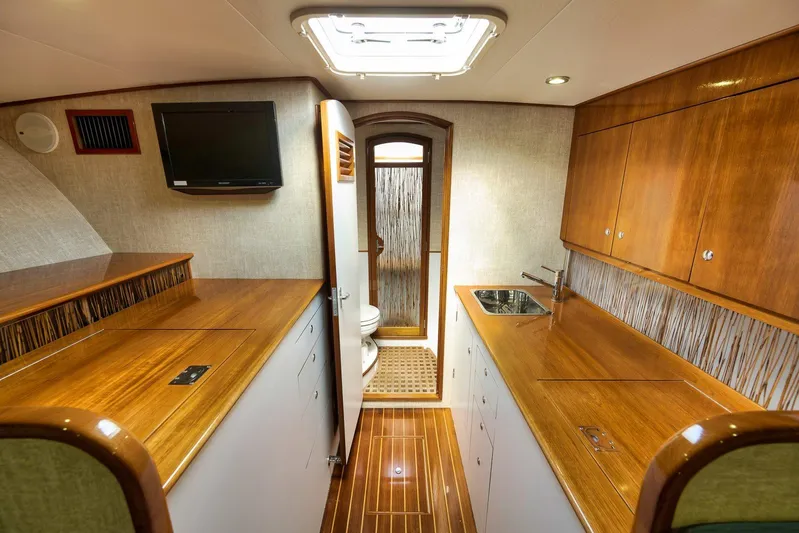 Sparkle Plenty Yacht Photos Pics Luxurious 2009 Gamefisherman Express yacht interior with wood finishes and modern amenities.