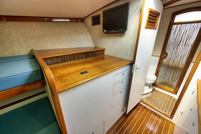 Sparkle Plenty Yacht Photos Pics Luxurious 2009 Gamefisherman Express cabin interior with wood accents and modern amenities.