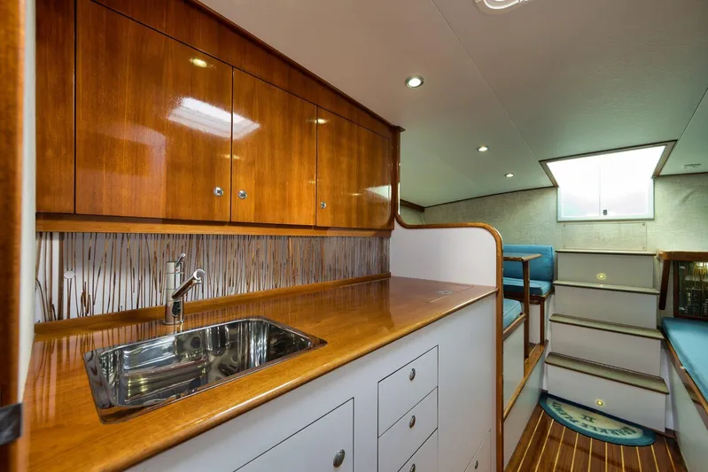 Sparkle Plenty Yacht Photos Pics Luxurious 2009 Gamefisherman Express interior with wooden cabinetry and modern amenities.