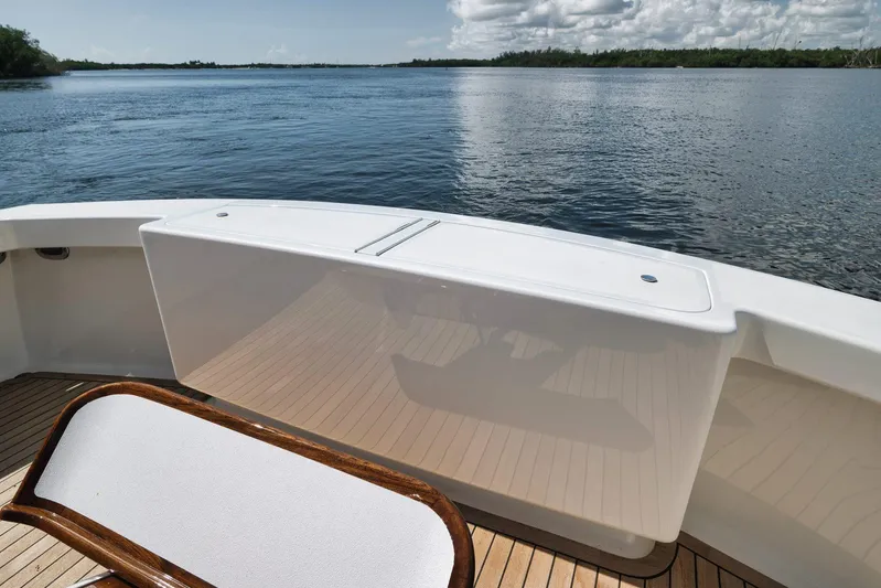 Sparkle Plenty Yacht Photos Pics 2009 Gamefisherman Express boat deck with scenic water view and clear skies.