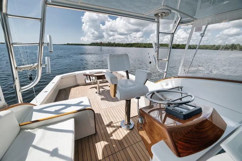 Sparkle Plenty Yacht Photos Pics 2009 Gamefisherman Express boat interior with helm, seating, and ocean view.