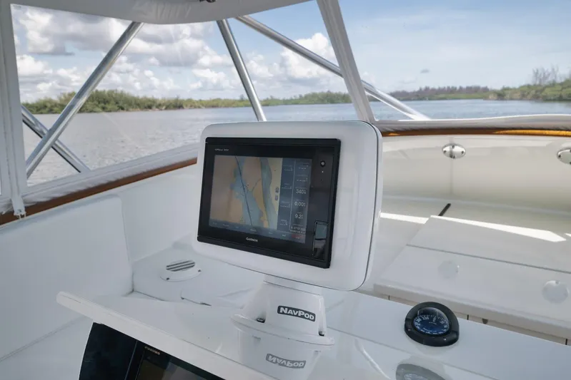 Sparkle Plenty Yacht Photos Pics 2009 Gamefisherman Express boat with Garmin navigation system on open water.