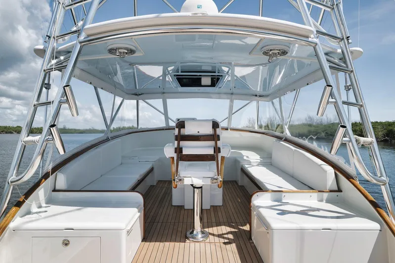 Sparkle Plenty Yacht Photos Pics 2009 Gamefisherman Express boat interior with white seating and wooden accents.