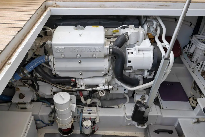 Sparkle Plenty Yacht Photos Pics Engine compartment of 2009 Gamefisherman Express boat, featuring CAT Marine Power engine.