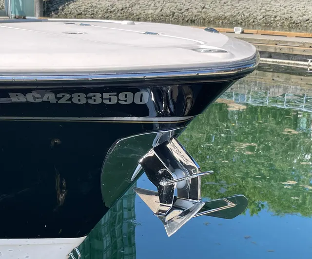  Yacht Photos Pics 2014 Grady-White Canyon 306 boat bow with anchor, docked in calm water.