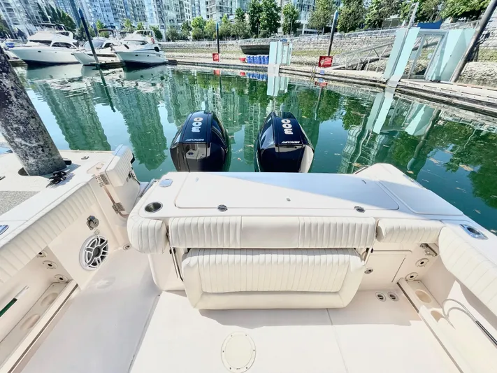  Yacht Photos Pics 2014 Grady-White Canyon 306 boat with twin outboard motors docked in a marina.