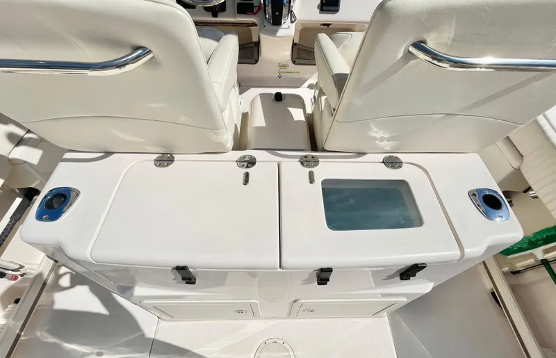  Yacht Photos Pics 2014 Grady-White Canyon 306 boat interior with seating and storage compartments.