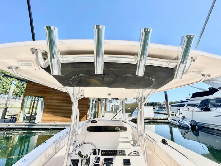  Yacht Photos Pics 2014 Grady-White Canyon 306 boat interior with rod holders, docked at marina.