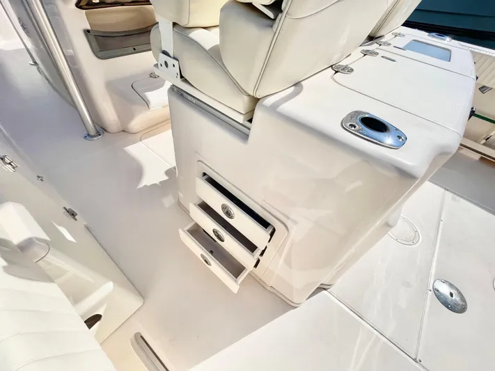  Yacht Photos Pics 2014 Grady-White Canyon 306 boat interior with seating and storage compartments.