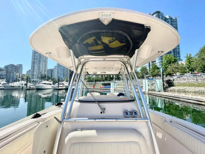  Yacht Photos Pics 2014 Grady-White Canyon 306 boat docked in a marina with cityscape background.