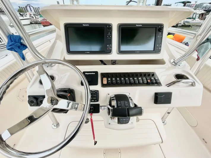  Yacht Photos Pics 2014 Grady-White Canyon 306 helm with dual displays and steering wheel.