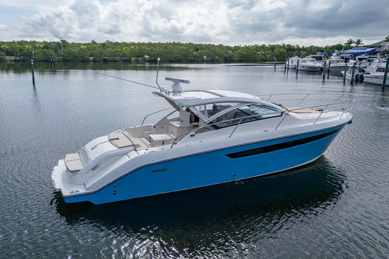  Yacht Photos Pics 2018 Pursuit SC 365i Sport Coupe yacht on calm water, showcasing sleek design.