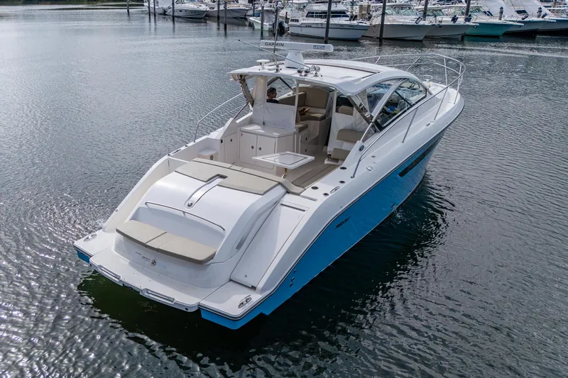  Yacht Photos Pics 2018 Pursuit SC 365i Sport Coupe yacht on calm water, rear view.