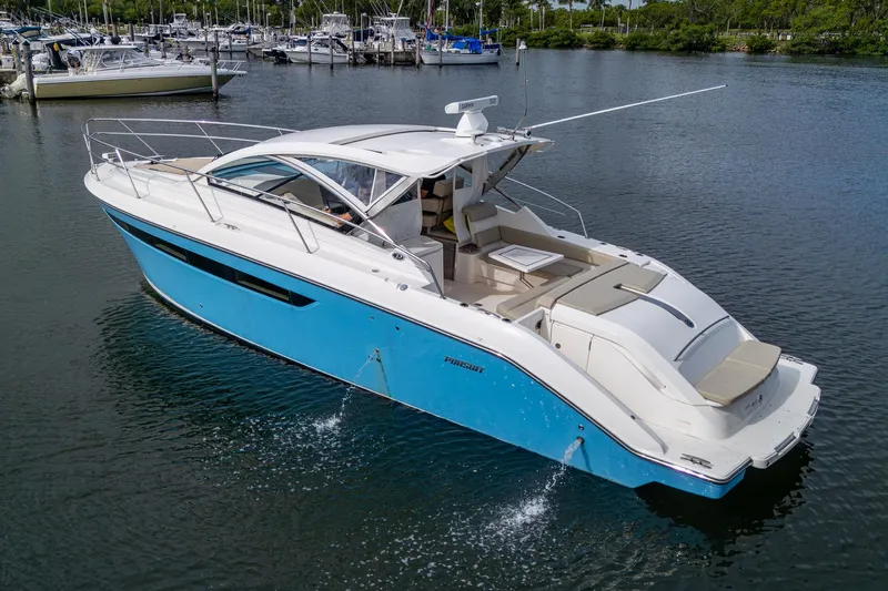  Yacht Photos Pics 2018 Pursuit SC 365i Sport Coupe boat on calm water, featuring sleek design and spacious deck.