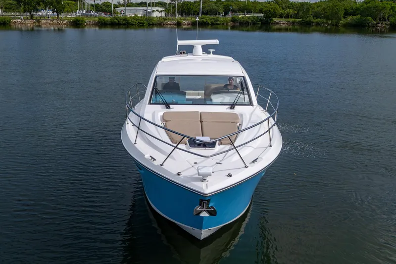  Yacht Photos Pics 2018 Pursuit SC 365i Sport Coupe on calm water, front view.