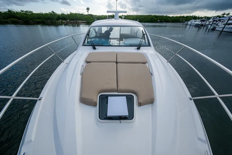 Yacht Photos Pics 2018 Pursuit SC 365i Sport Coupe on calm water, featuring spacious deck and sleek design.
