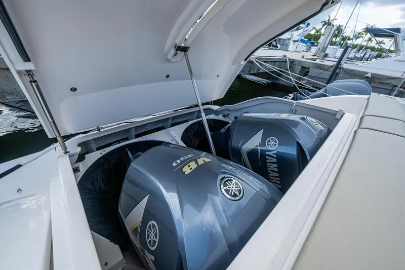  Yacht Photos Pics 2018 Pursuit SC 365i Sport Coupe with Yamaha V8 engines in open compartment.