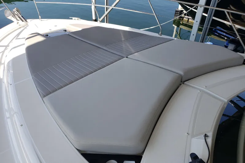 Tu Madre Yacht Photos Pics Sunbathing deck on 2019 Beneteau Gran Turismo 46 yacht, featuring comfortable cushions.