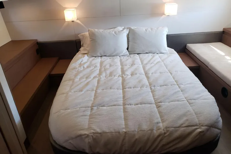 Tu Madre Yacht Photos Pics Luxurious bedroom interior of 2019 Beneteau Gran Turismo 46 yacht with cozy bedding.