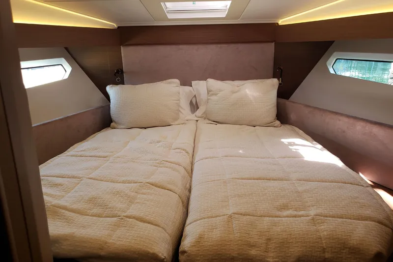 Tu Madre Yacht Photos Pics Luxurious cabin interior of 2019 Beneteau Gran Turismo 46 yacht with cozy bedding.