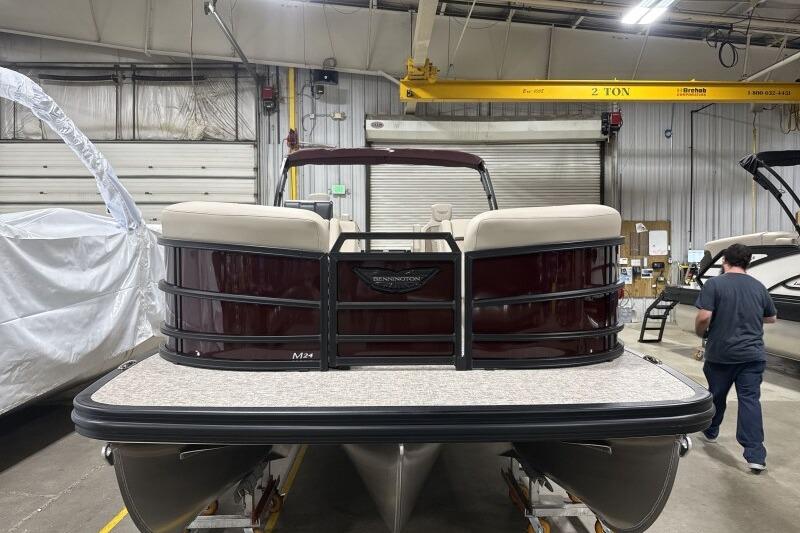 2026 Bennington 24 MOFBSF pontoon boat in a warehouse setting.