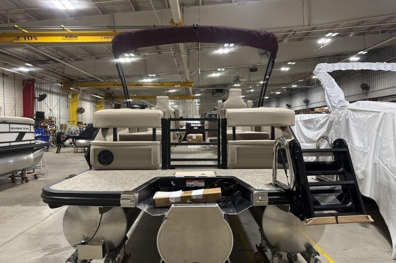 2026 Bennington 24 MOFBSF pontoon boat in a warehouse setting.