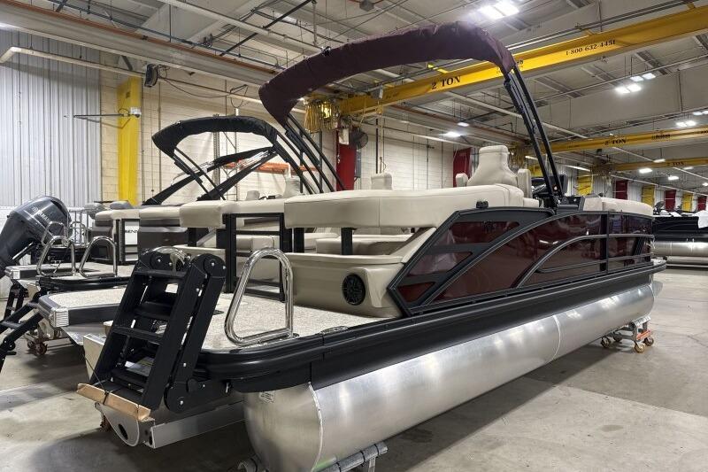 2026 Bennington 24 MOFBSF pontoon boat in a factory setting.